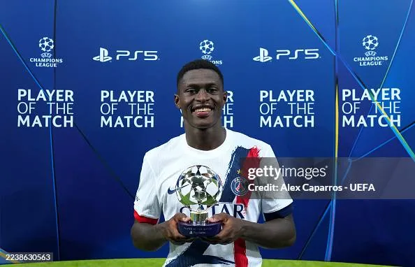 Nuno Mendes holding a UEFA Player of the Match award