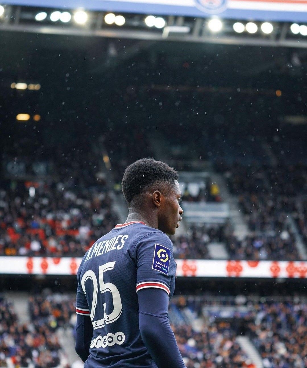 Nuno Mendes in the rain during a match